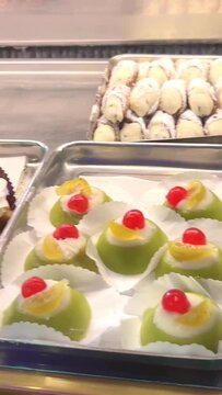 Tradition italian desserts as sicilian cannoli, sicilian cassata, typical fresh pastry at bakery shop bar,  Sicily, Italy