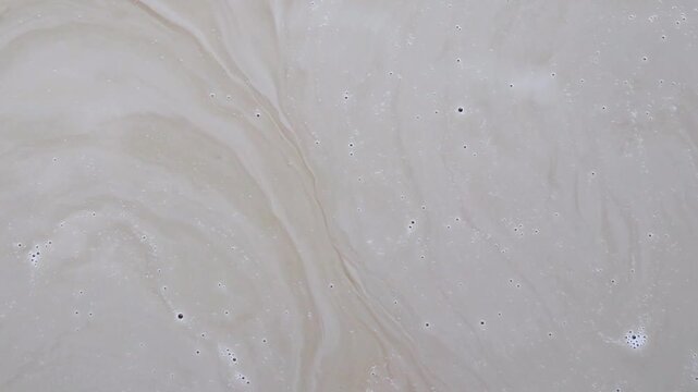 abstract coffee and milk foam swirl texture background