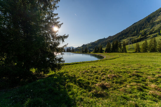 Sunny evening at Seealpe reservoir on Nebelhorn Mountain