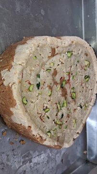 Traditional Indian Milk Cake Sweet decorated with Pistachios and Saffron