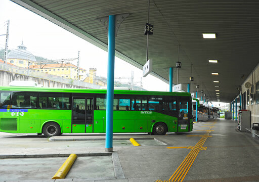 
Oviedo bus station, Principality of Asturias, northern Spain. Llaneza company bus at the platforms inside the Oviedo station. Bus routes in Asturias. Tourism in the beautiful Asturias.