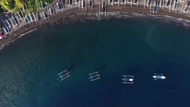 Aerial Drone Footage Amed Bay Traditional Fishing Boats Bali Coastline.