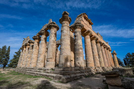 Dome of the temple of Zeus in Cyrene stands tall amid blue sky and ancient ruins in Libya
