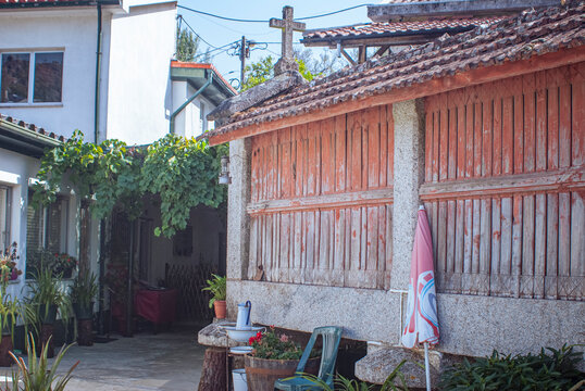Geres, Portugal: Traditional stone and wood granary with tiled roof in a courtyard