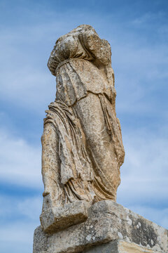 Sculpture of a figure from the ancient city of Cyrene in Eastern Libya showcasing historical architecture and cultural heritage