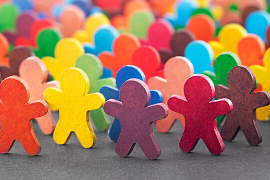 Colorful painted group of wooden people figures
