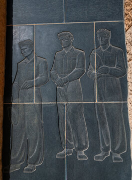 Monument showing three soldiers at the German World War 2 cemetery in Tobruk, Eastern Libya, honoring those who served during the conflict