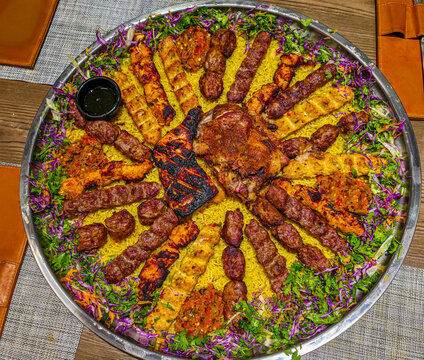 Traditional Libyan food platter features various meats and sides enjoyed in Tobruk