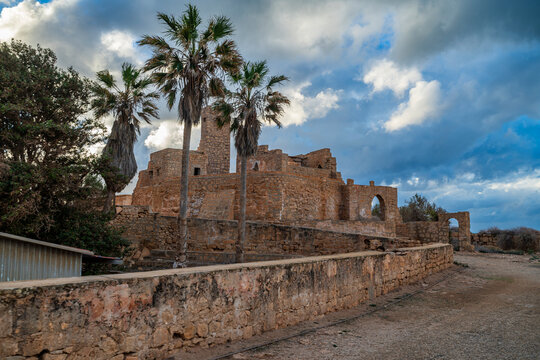 Fortifications of ancient Greek city Tocra seen amid palm trees in Eastern Libya