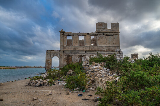 Historic coral ruins and landscape on Suakin Island with sea and sky in view during the day