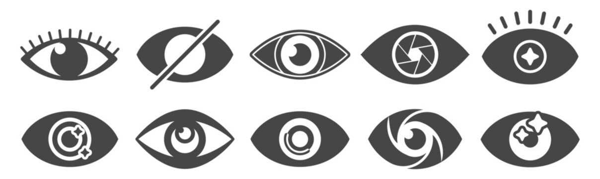 Eye icon set with varied pupil and iris designs. Vision and focus symbols on transparent background.