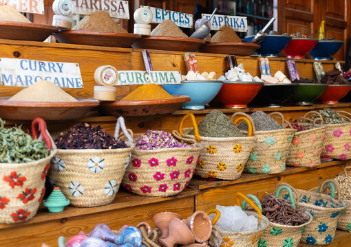 Souvenirs and spices displayed in baskets at the market in Marrakesh, Morocco