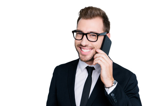 Close up portrait of excited joyful smart clever intelligent self-empyoed man wearing formal outfit, he is talking on phone about organizing meeting with business partners, isolated on gray background