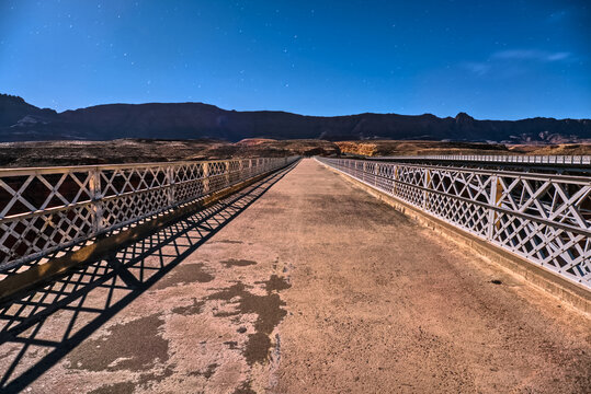 Exploring Twin Bridges at Navajo Crossing in Marble Canyon under moonlight on a clear night sky