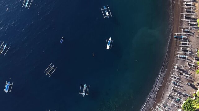 Drone Flying Along Amed Beach Coastline Traditional Jukung Boats Bali.