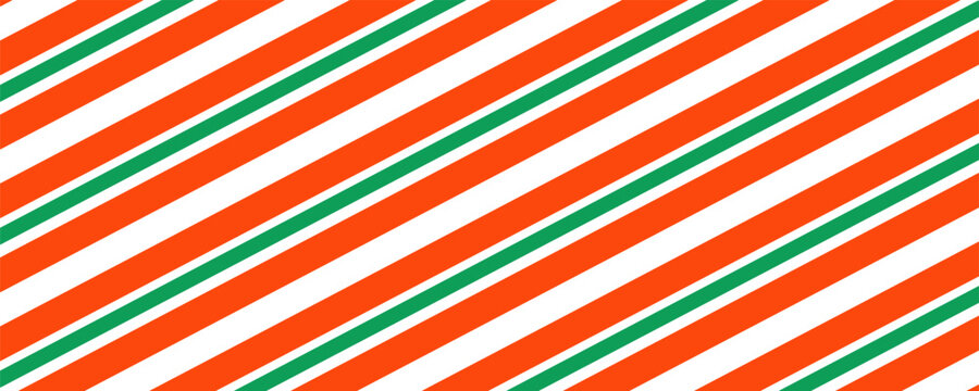Christmas seamless pattern. Red and green diagonal stripes background. Candy cane repeating decoration wallpaper. Winter holiday lines backdrop. Xmas peppermint package wrapping print design. Vector