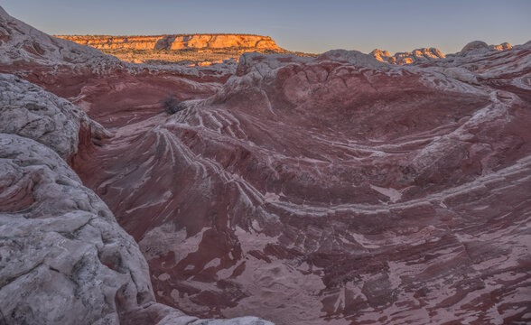 Unique sandstone formations show colorful layers and textures of White Pocket at sunset in Arizona&rsquo;s Vermilion Cliffs National Monument