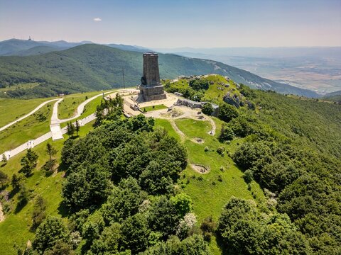 Drone view of Shipka Monument on Mount Shipka National Park in Stara Zagora, Bulgaria showing surrounding hills and paths