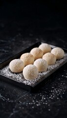 Fototapeta premium Generative AI showcases elegant spherical confections dusted with icing sugar
