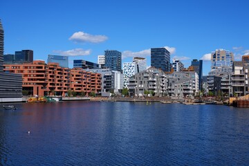 Fototapeta premium Bjorvika waterfront skyline in Oslo city, Norway. Modern district photo on a sunny day.