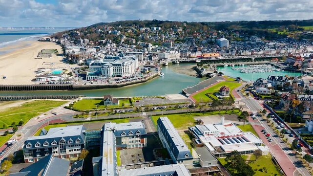 Trouville-Deauville seaside resort town with urban waterfront and traditional Normandy architecture. Aerial view in France