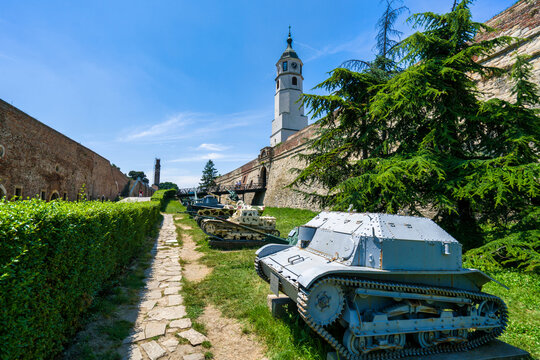 Military museum features old tank and cannon in front of Sahat Kula clock tower at Kalemegdan park in Belgrade, Serbia