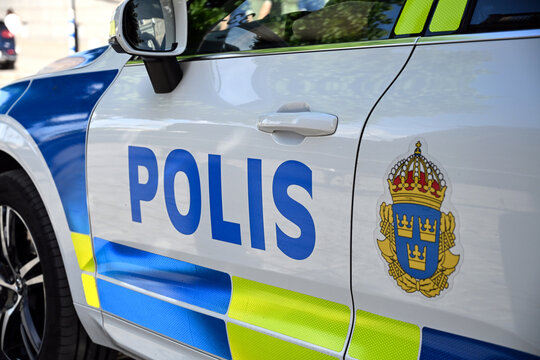 Swedish police vehicle with POLIS markings. Police patrol car in Stockholm. Swedish POLIS patrol vehicle with Swedish police coat of arms.