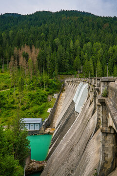Hydropower generation at Santa Caterina dam in the Italian Alps with surrounding forest