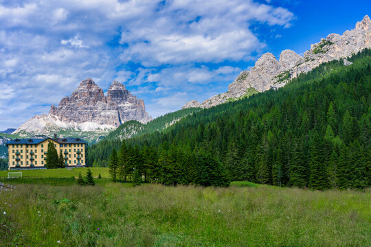 Grand Hotel Misurina located in the Dolomites with mountains in the background and clear sky