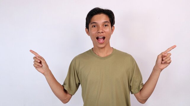Asian young man gestures pointing left and right side