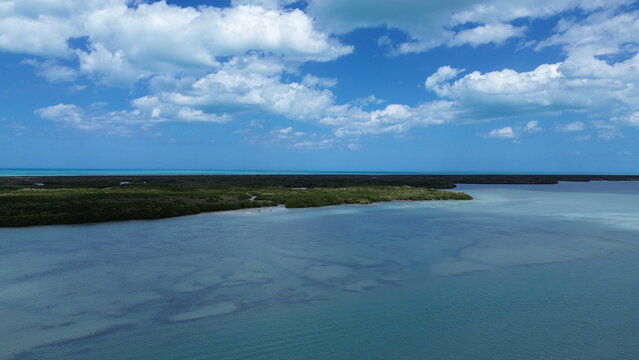 Aerial view of mangrove islands and vibrant turquoise sea in Rio Lagartos biosphere reserve, Mexico