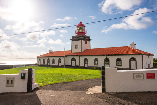 Lighthouse of Lajes standing by the Atlantic Ocean on Flores Island in Azores, Portugal, a site of maritime navigation and coastal views