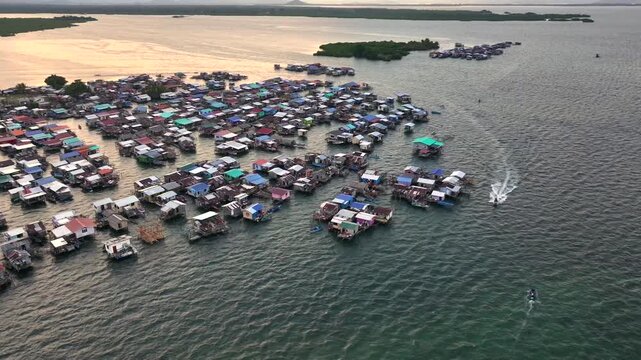 Bornean Stilt Houses on the Sea Waters. Traditional Bajau Laut Village, Sea Gypsy people in Semporna, Borneo, Malaysia. 