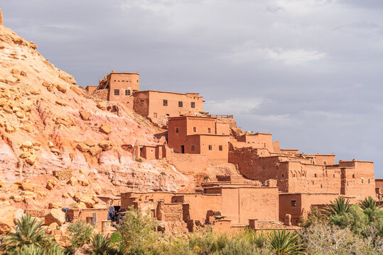Fortified village at Ben Haddou on a hillside under warm sunlight in southern Morocco with scattered clouds