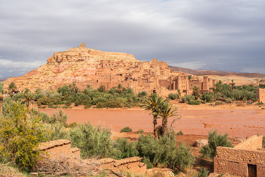 View of Ait Ben Haddou with palm oasis near Ounila River valley in Morocco