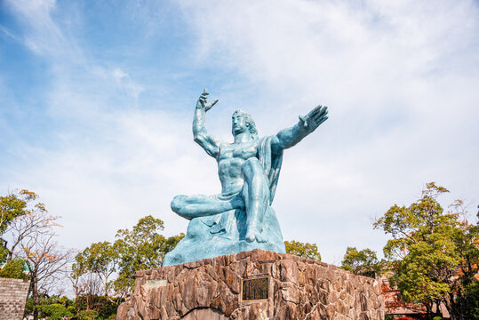 Nagasaki Peace Statue shows divine warning and compassion in Nagasaki, Japan with hands raised to symbolize hope and remembrance