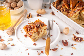 Tasty autumn Cinnamon Pecan Pancake Breakfast Casserole with honey © ricka_kinamoto