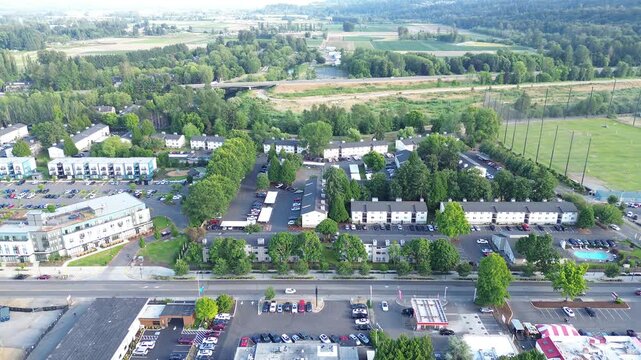 Manicured playing fields sit adjacent to community parking zones in Kent, WA. Open greenspace provides recreational respite near regional logistical hubs found across this expansive valley floor