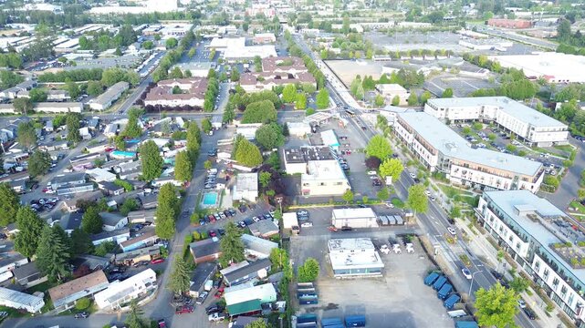 Baseball fields border expansive woodland corridors near regional neighborhood sectors in Kent, WA. Integrated parking lots facilitate access to outdoor sports facilities situated in this vicinity