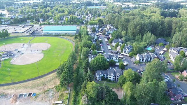 Fairways border residential complexes near community woodland buffers in Kent, WA. Landscaped greens provide serene backdrops where suburban living meets recreational space throughout this area