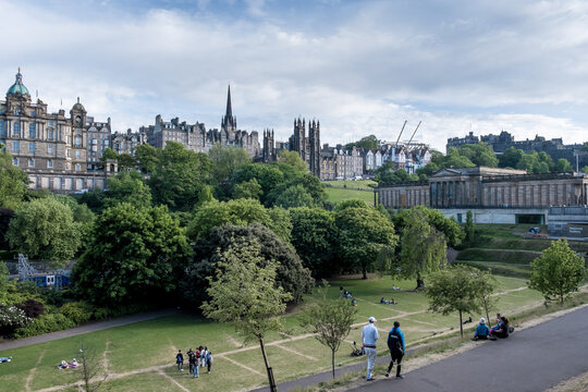 View of East Princes Street Gardens and Edinburgh Castle from the walking path in the city center of Edinburgh, Scotland