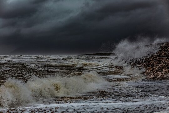 Breezy conditions with rain clouds and waves at Walney Island on the Cumbrian Coast