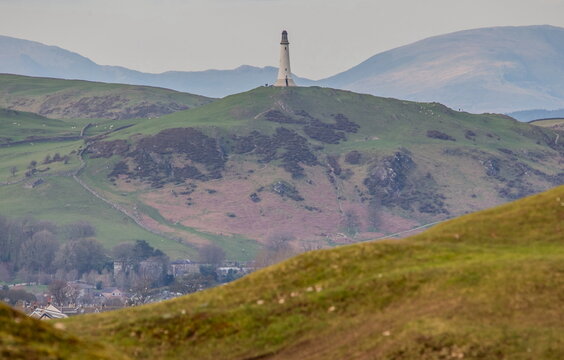 View of the John Barrow Monument from Birkrigg in Ulverston with hills and landscape visible in the distance