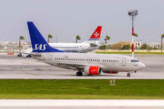 Luqa, Malta - January 22, 2005: Scandinavian Airlines - SAS Boeing 737-683 (REG: LN-RPA) exiting apron 9 for runway 32 for take off.