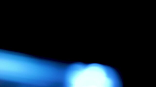 Blue lines of light circle and move across the frame, creating a 4K abstract effect with dynamic motion and cool glowing visual texture.