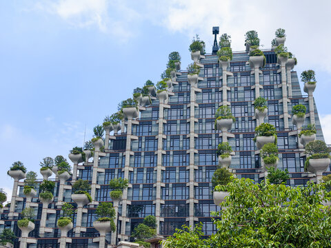 1000 trees building with planters on pillars creates vertical garden facade. unique tree design transforms shanghai architecture. SHANGHAI, China - May 25, 2026