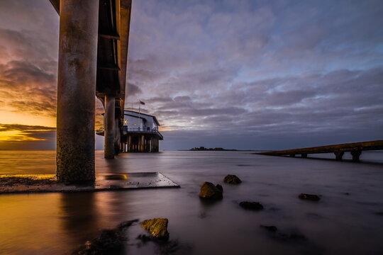 Sunrise at Roa Island Lifeboat Station with Piel Island in the distance over the Cumbrian coast