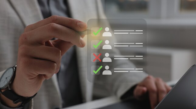 Businessman evaluating job candidates on virtual screen for recruitment and human resources management