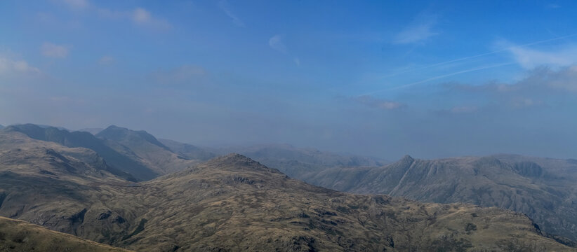 Hazy view from Wetherlam mountain in the Lake District of Cumbria on a clear day in the UK