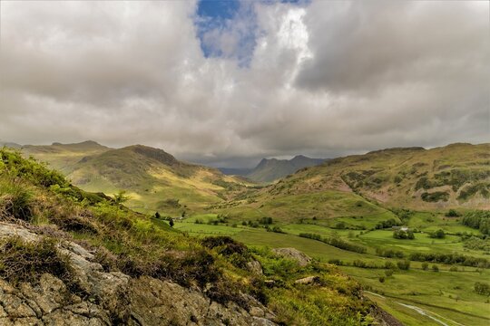View over Little Langdale Valley with Langdale Pikes in the background on 3rd June 2022